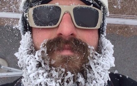 A climber with a frozen beard after a climb.