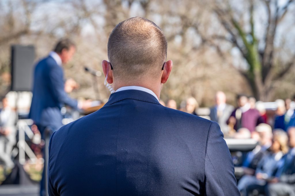 A member of the Executive Protection Unit stands watch.